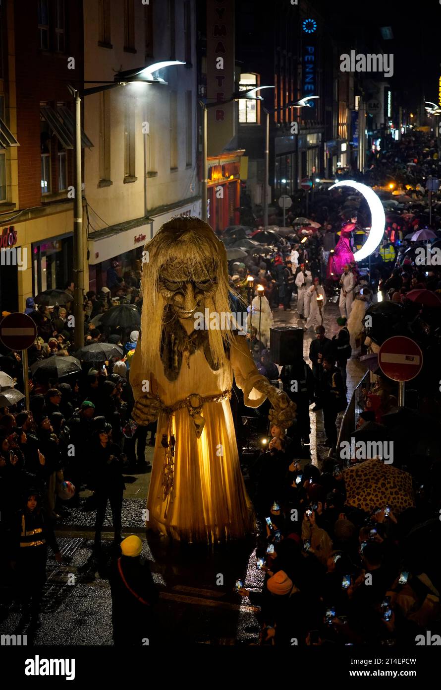 Crowds watch the Macnas Halloween Parade in Dublin city centre part of