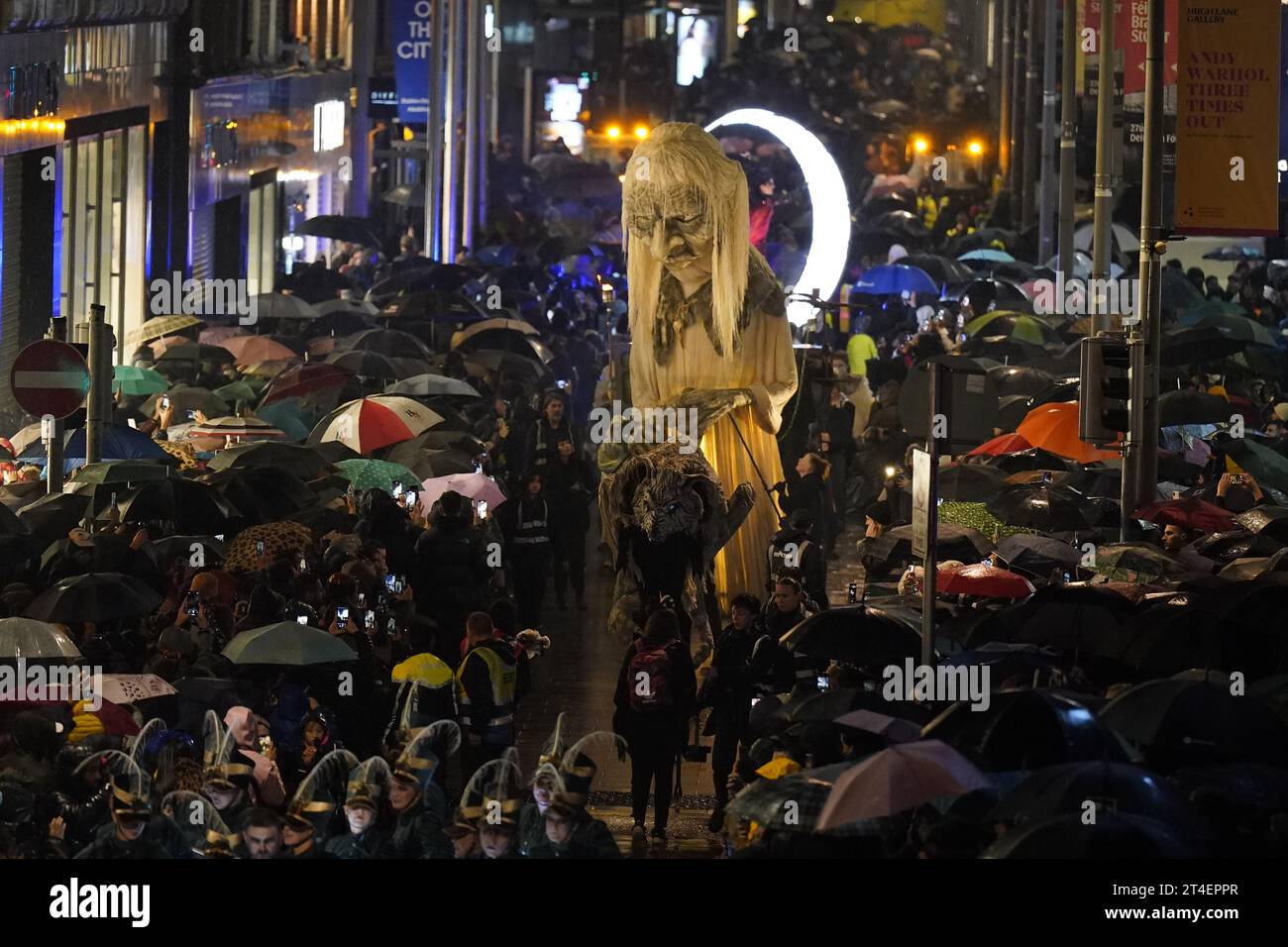 Crowds watch the Macnas Halloween Parade in Dublin city centre part of