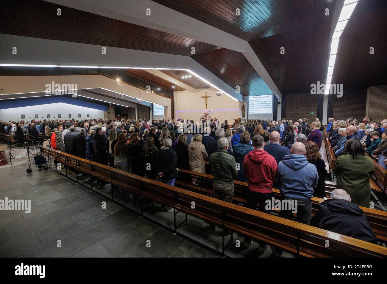 People at a service to mark the 30th anniversary of the Greysteel shooting, at the Star of the Sea Church in Greysteel, Co Londonderry. Eight people were killed and nineteen wounded by loyalists during a Halloween party at the Rising Sun Bar on October 30, 1993. Picture date: Monday October 30, 2023. Stock Photo