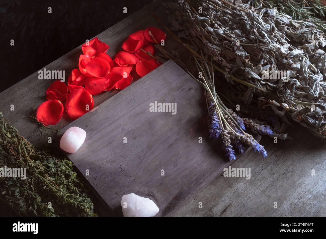 table to prepare traditional ritual on a wooden board, lavender, roses and rosemary Stock Photo