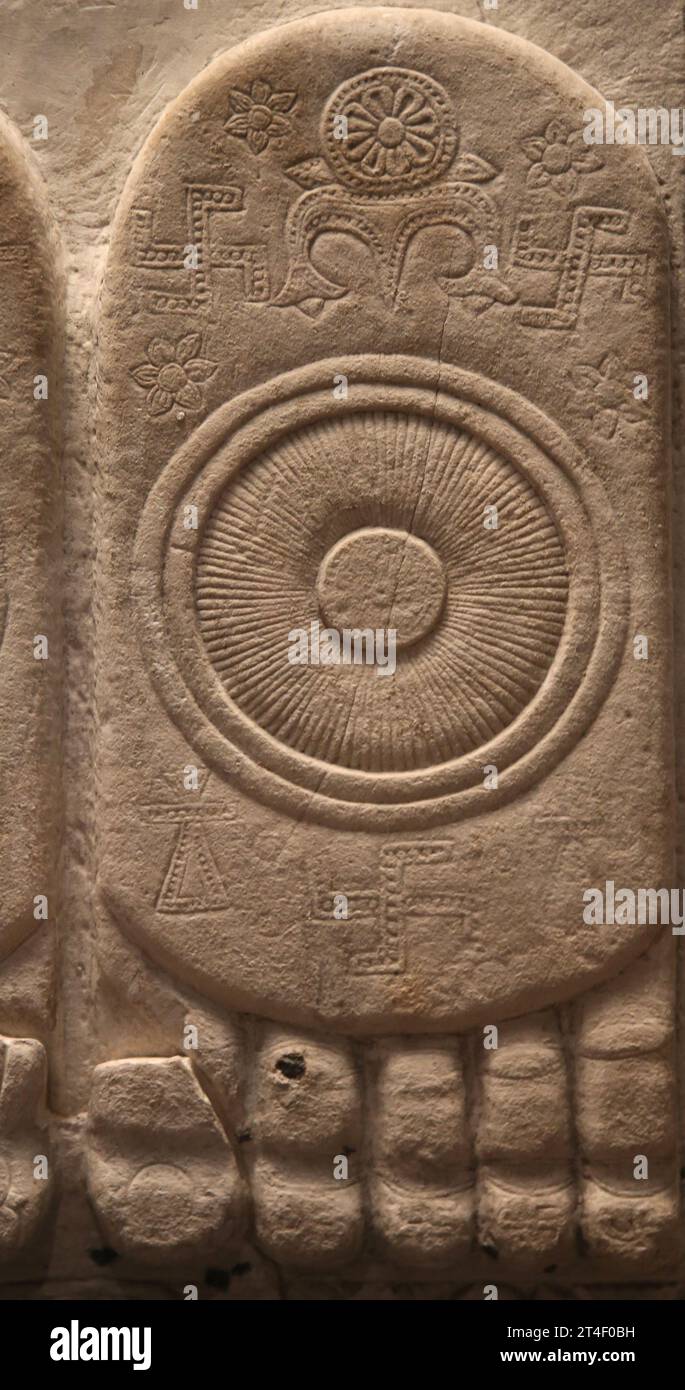 Buddha's footprint. Relief with the Buddhapada. Amaravati (southeast India). 1st century BC. Stone. Sole of Buddha's feet. The circles( wheels of law) Stock Photo