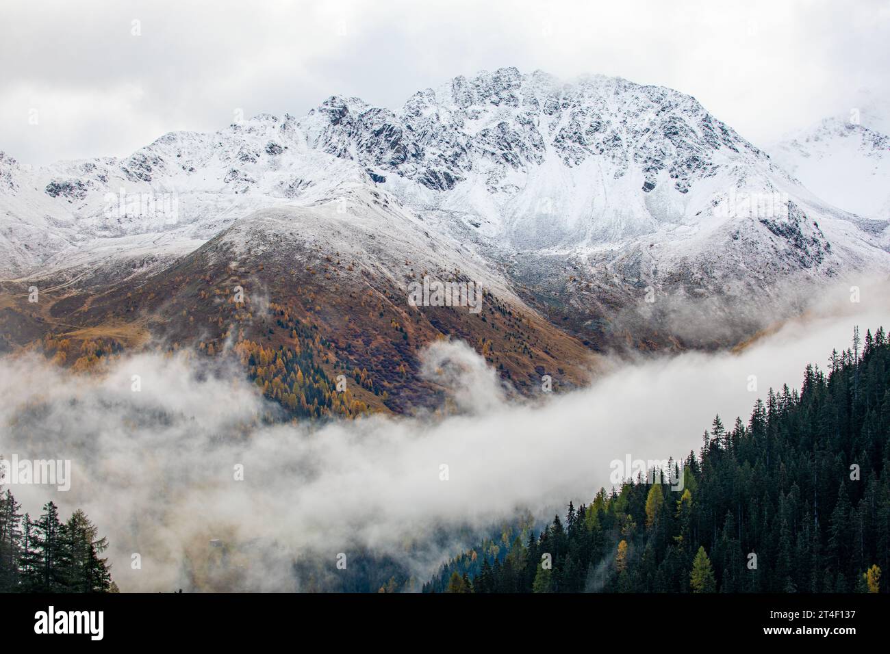 Amazing view over snow covered mountains with first snow in October. Near Davos, Switzerland Stock Photo