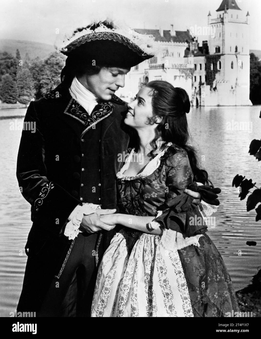 Richard Chamberlain, Gemma Craven, on-set of the British musical film, 'The Slipper and the Rose: The Story of Cinderella', Universal Pictures, 1976 Stock Photo