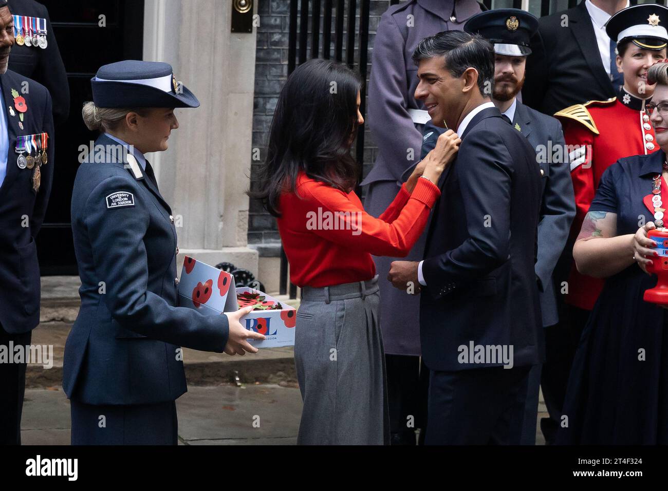 London, UK. 30th Oct, 2023. British Prime Minister Rishi Sunak and wife Akshata Murthy with fundraisers from The Royal British Legion's Poppy Appeal seen after purchasing his own poppy in Downing Street in London. Credit: SOPA Images Limited/Alamy Live News Stock Photo
