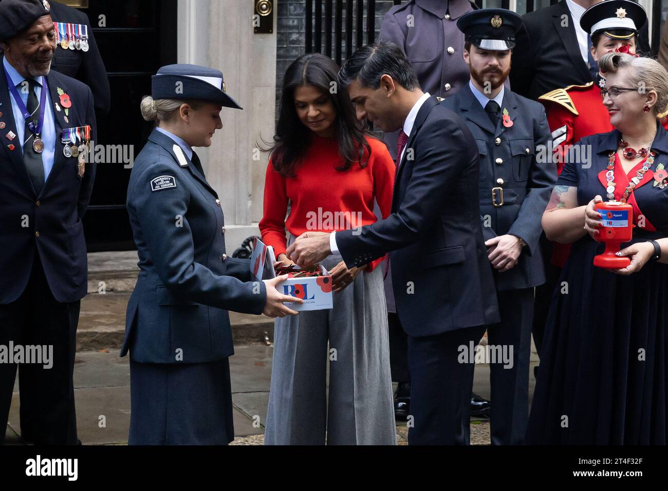 London, UK. 30th Oct, 2023. British Prime Minister Rishi Sunak and wife Akshata Murthy with fundraisers from The Royal British Legion's Poppy Appeal seen after purchasing his own poppy in Downing Street in London. Credit: SOPA Images Limited/Alamy Live News Stock Photo