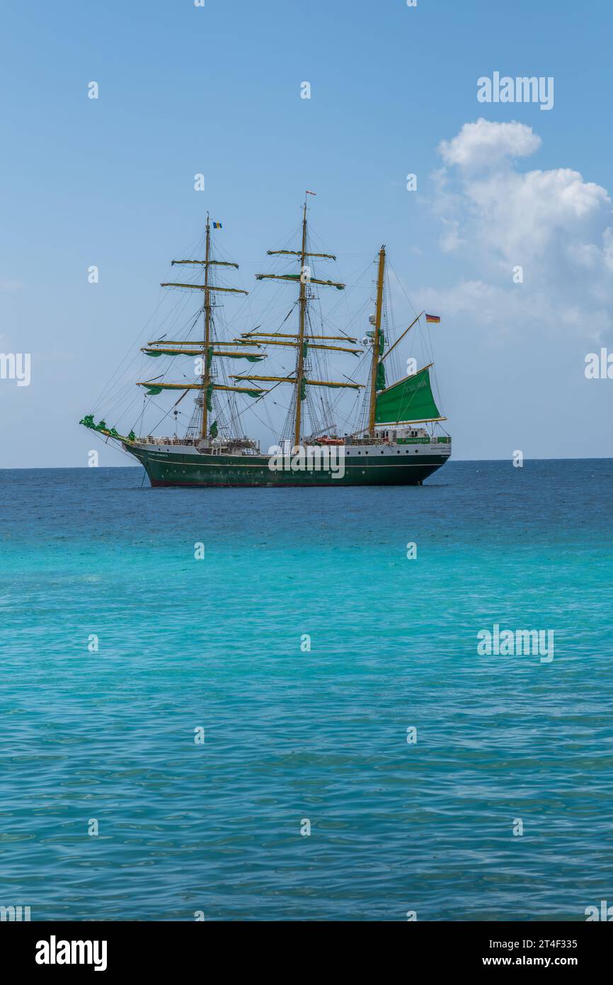 A traditional, old fashioned sailing ship on a blue tropical sea Stock Photo
