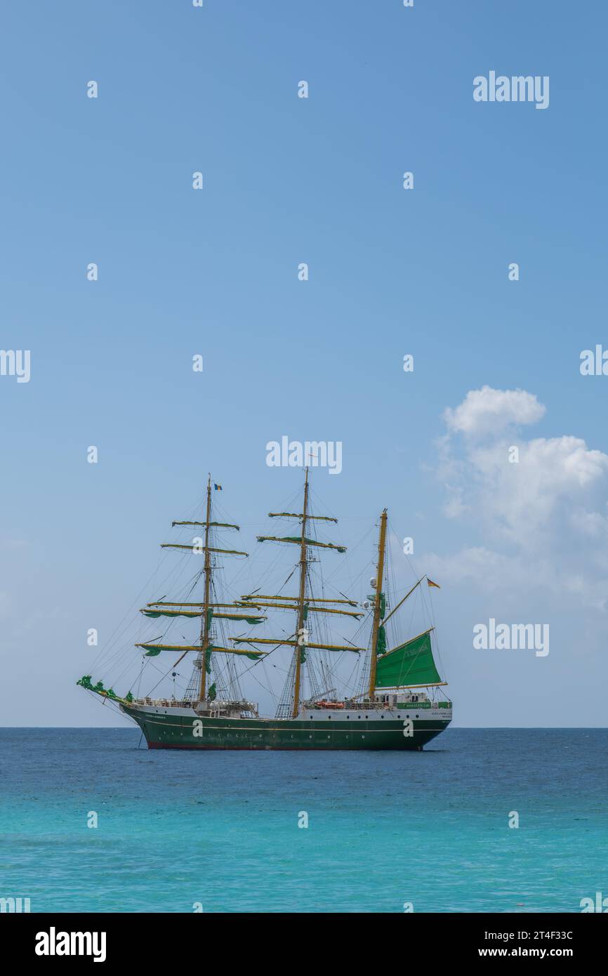 A traditional, old fashioned sailing ship on a blue tropical sea Stock Photo