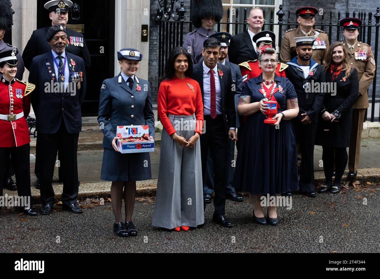 London, UK. 30th Oct, 2023. British Prime Minister Rishi Sunak and wife Akshata Murthy pose with fundraisers from The Royal British Legion's Poppy Appeal after purchasing his own poppy in Downing Street in London. Credit: SOPA Images Limited/Alamy Live News Stock Photo