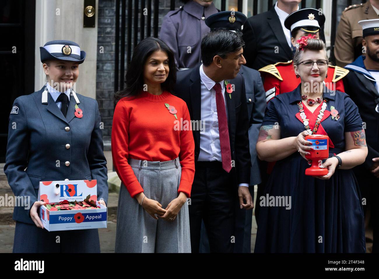 London, UK. 30th Oct, 2023. British Prime Minister Rishi Sunak and wife Akshata Murthy pose with fundraisers from The Royal British Legion's Poppy Appeal after purchasing his own poppy in Downing Street in London. Credit: SOPA Images Limited/Alamy Live News Stock Photo