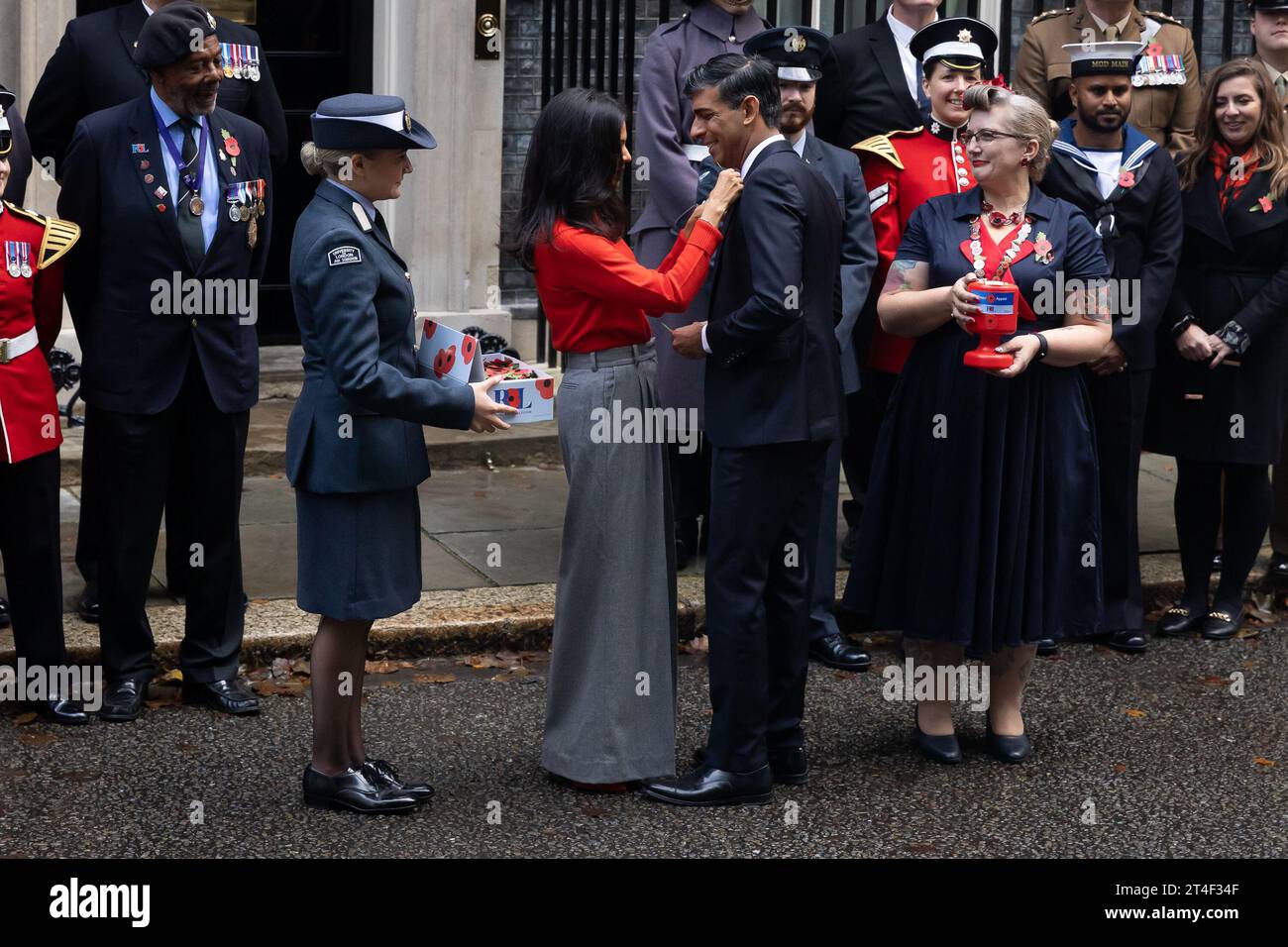 London, UK. 30th Oct, 2023. British Prime Minister Rishi Sunak and wife Akshata Murthy with fundraisers from The Royal British Legion's Poppy Appeal seen after purchasing his own poppy in Downing Street in London. Credit: SOPA Images Limited/Alamy Live News Stock Photo