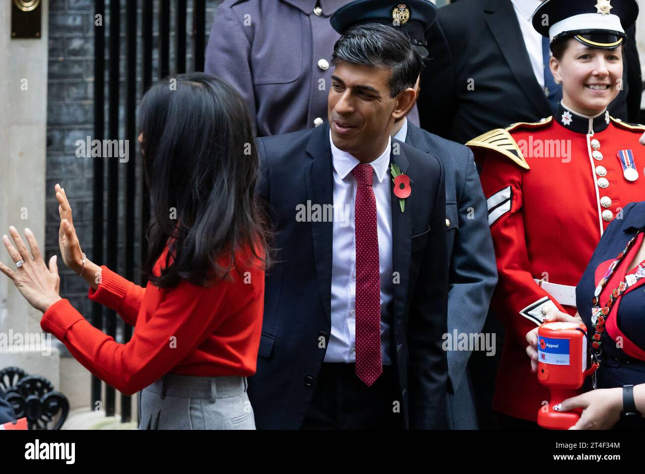 London, UK. 30th Oct, 2023. British Prime Minister Rishi Sunak and wife Akshata Murthy with fundraisers from The Royal British Legion's Poppy Appeal seen after purchasing his own poppy in Downing Street in London. Credit: SOPA Images Limited/Alamy Live News Stock Photo