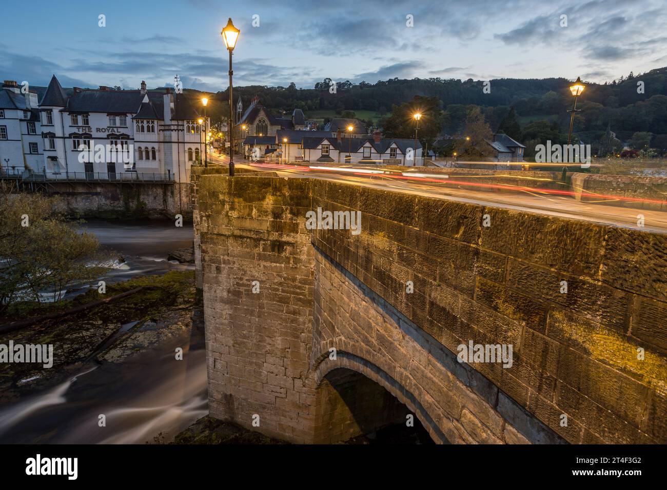 Traffic trails pictured over  Llangollen Bridge as the River Dee flows underneath and cars pass over the top. Stock Photo
