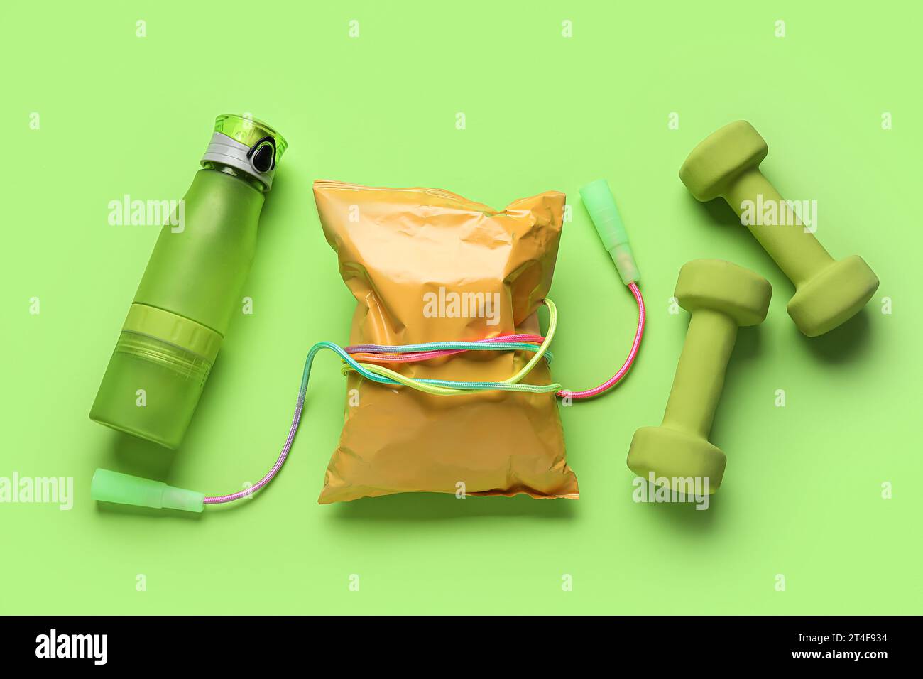 Healthy snack with skipping rope, dumbbells and bottle of water on ...