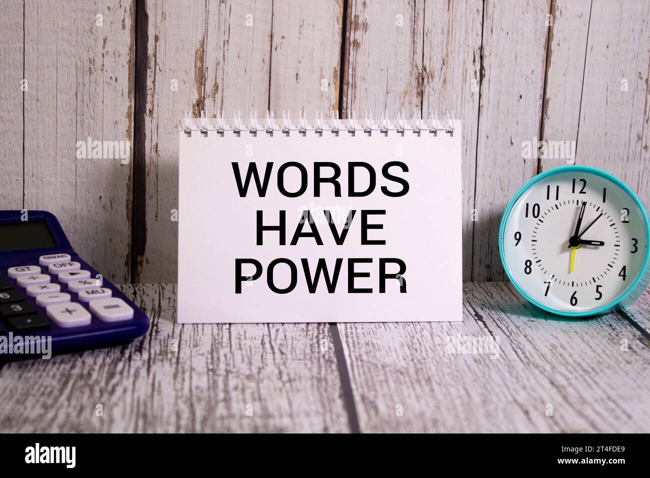White paper with text Words have power lying on the keyboard. Stock Photo