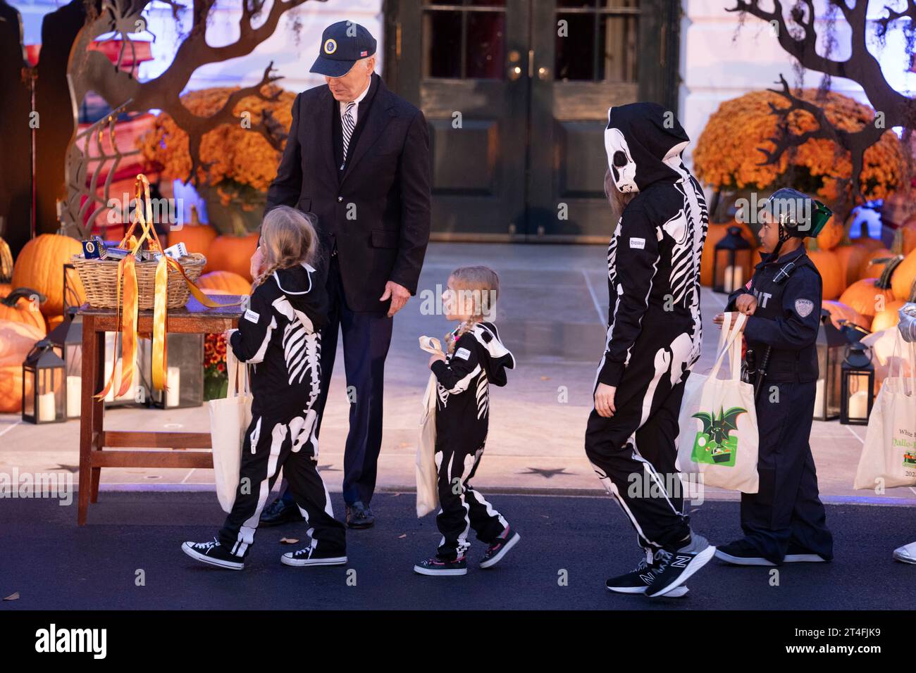 United States President Joe Biden welcomes Trick-or-Treaters to the White House in Washington, DC, October 30, 2023.Credit: Chris Kleponis/CNP/MediaPunch Stock Photo