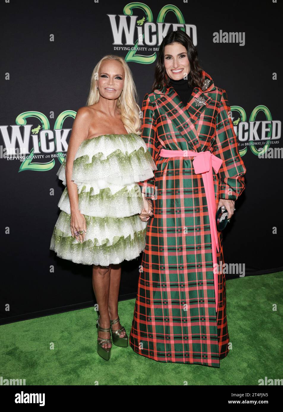 Kristin Chenoweth, left, and Idina Menzel attend the 20th anniversary