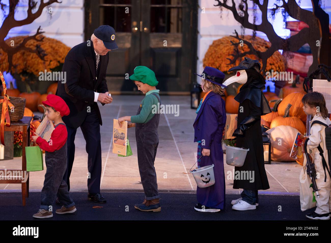 United States President Joe Biden Biden welcomes Trick-or-Treaters to the White House in Washington, DC, October 30, 2023.Credit: Chris Kleponis/CNP/MediaPunch Stock Photo