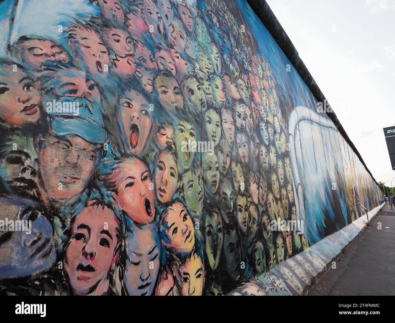 Crowd breaking through the Berlin Wall, painting on the