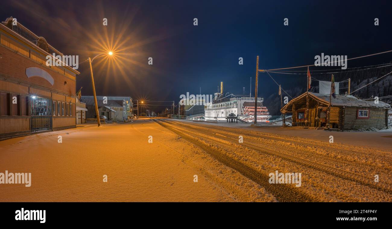 Night view of snowy Front Street in Dawson City, Yukon, Canada Stock Photo