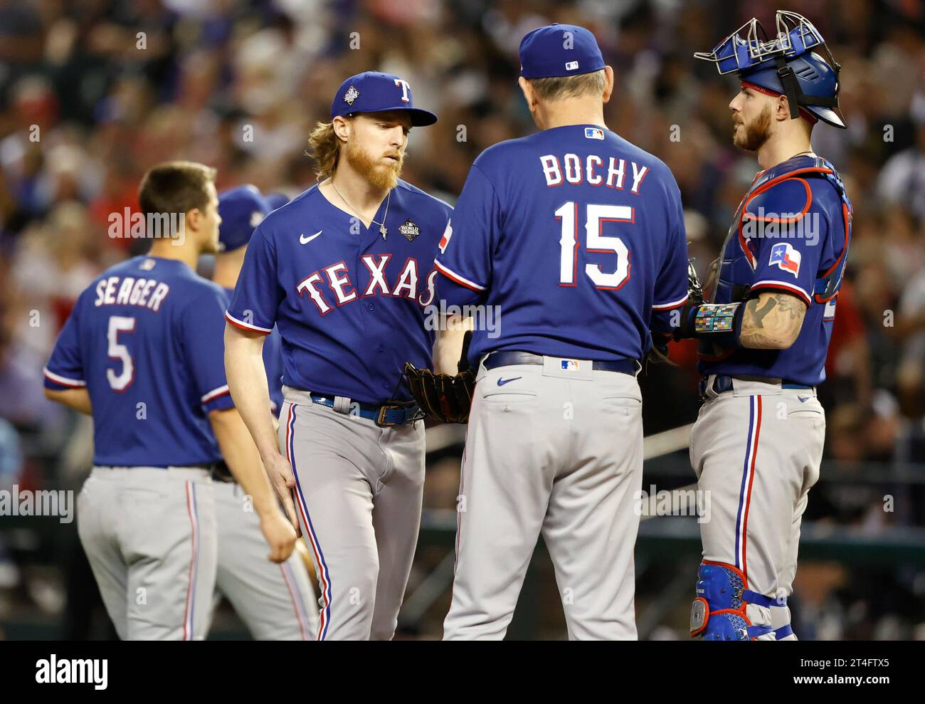 Phoenix, United States. 30th Oct, 2023. Texas Rangers manager Bruce Bochy hands the ball to relief pitcher Jon Gray after starting pitcher Max Scherzer was injured in the fourth inning against the Arizona Diamondbacks in game three of the 2023 World Series at Chase Field, in Phoenix, Arizona on Monday, October 30, 2023. Photo by John Angelillo/UPI Credit: UPI/Alamy Live News Stock Photo