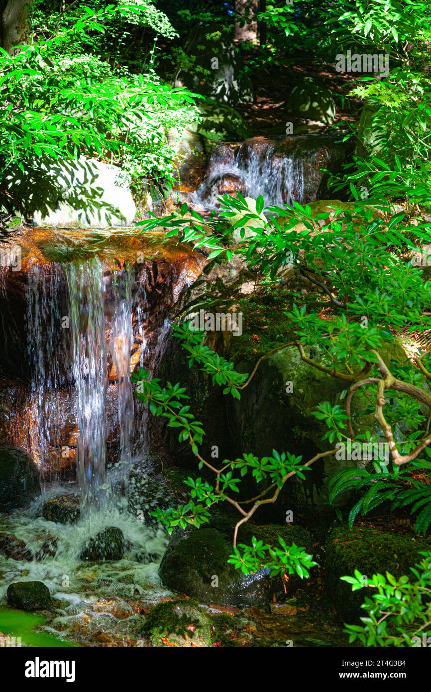 Small waterfall in Nitobe Japanese Garden at UBC Vancouver Canada Stock Photo