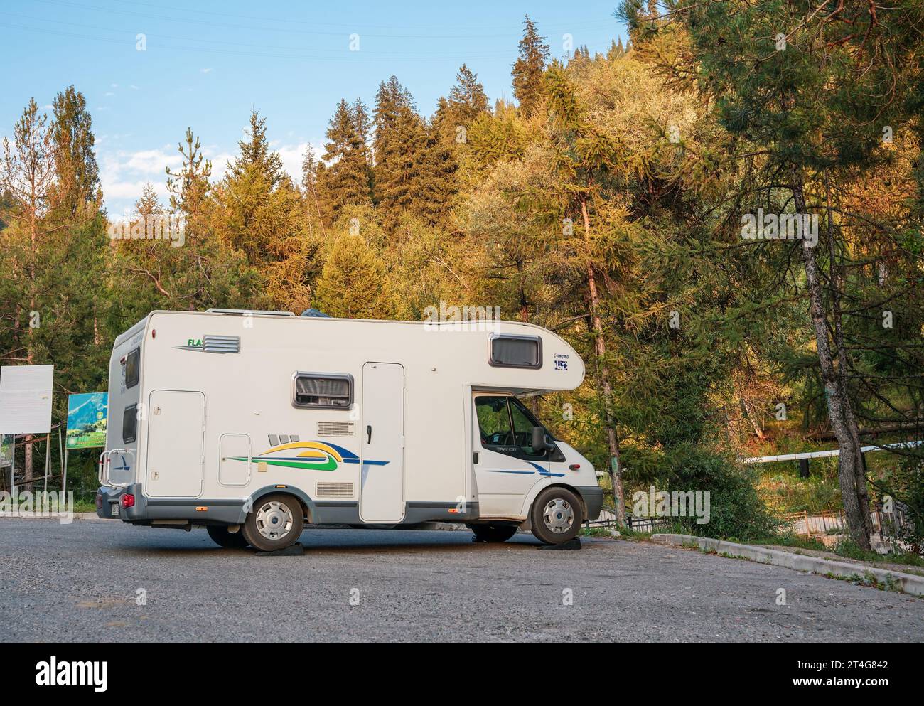 Almaty, Kazakhstan - August 18, 2023: A Ford Transit motorhome sits in a parking lot in the mountains. Travel on your own Stock Photo