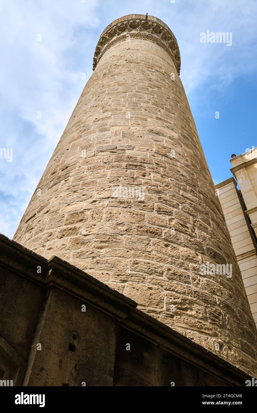 A view of the historic, Muslim, Juma (Friday) Mosque with tall, round, stone minaret. In the Old City section of Baku, Azerbaijan. Stock Photo