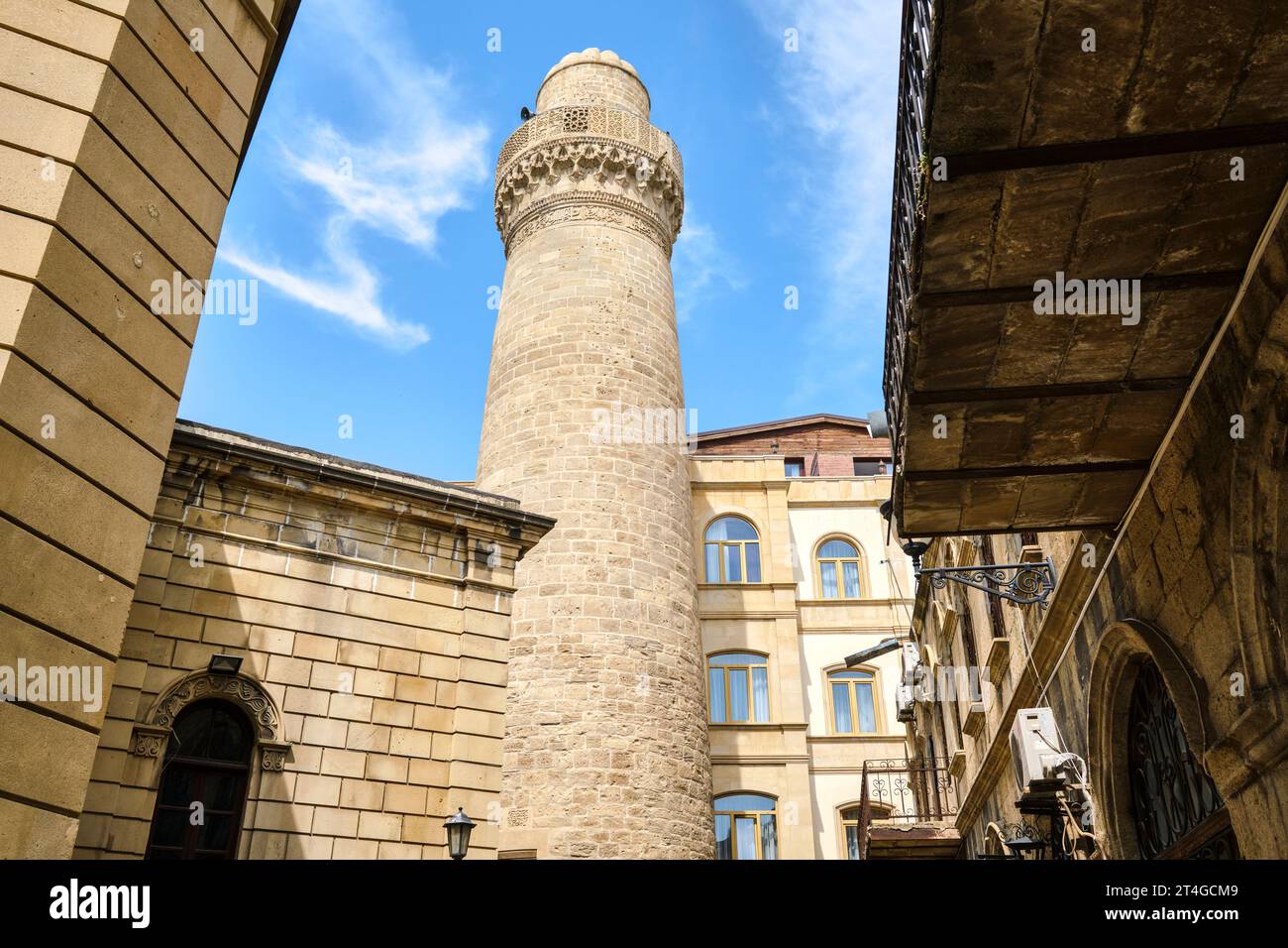 A view of the historic, Muslim, Juma (Friday) Mosque with tall, round, stone minaret. In the Old City section of Baku, Azerbaijan. Stock Photo