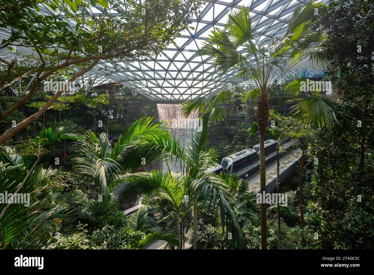 Sky Train travel inside Jewel Changi Airport for visitors to marvel at the lush green interior and world's tallest indoor waterfall Stock Photo