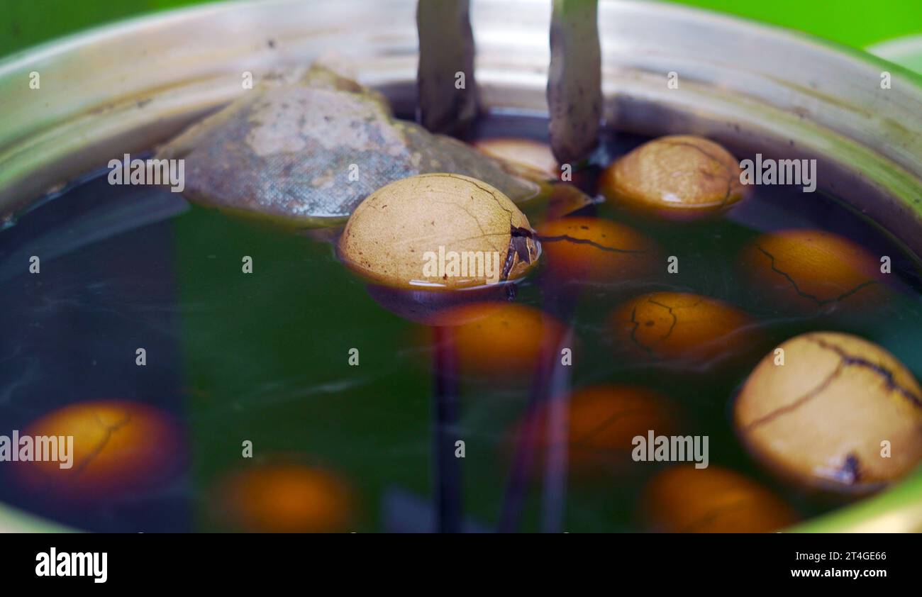 Close-up shot of tea eggs, boiling with tea sauce and spices. tea egg is a kind of traditional Taiwanese food Stock Photo