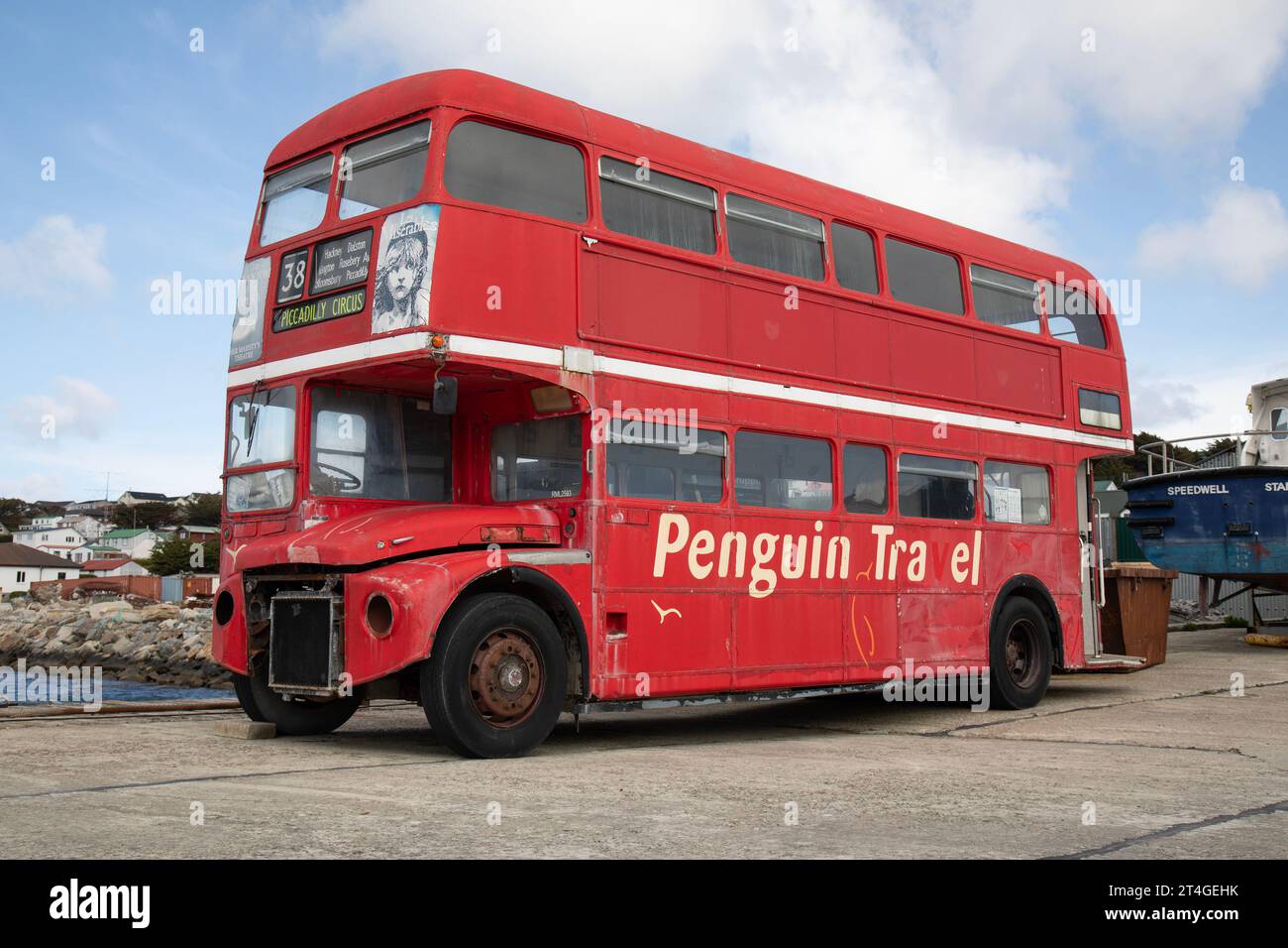 A London Routemaster Bus in Stanley on The Falkland Islands. belongs to Penguin Travel, a local travel company. Stock Photo