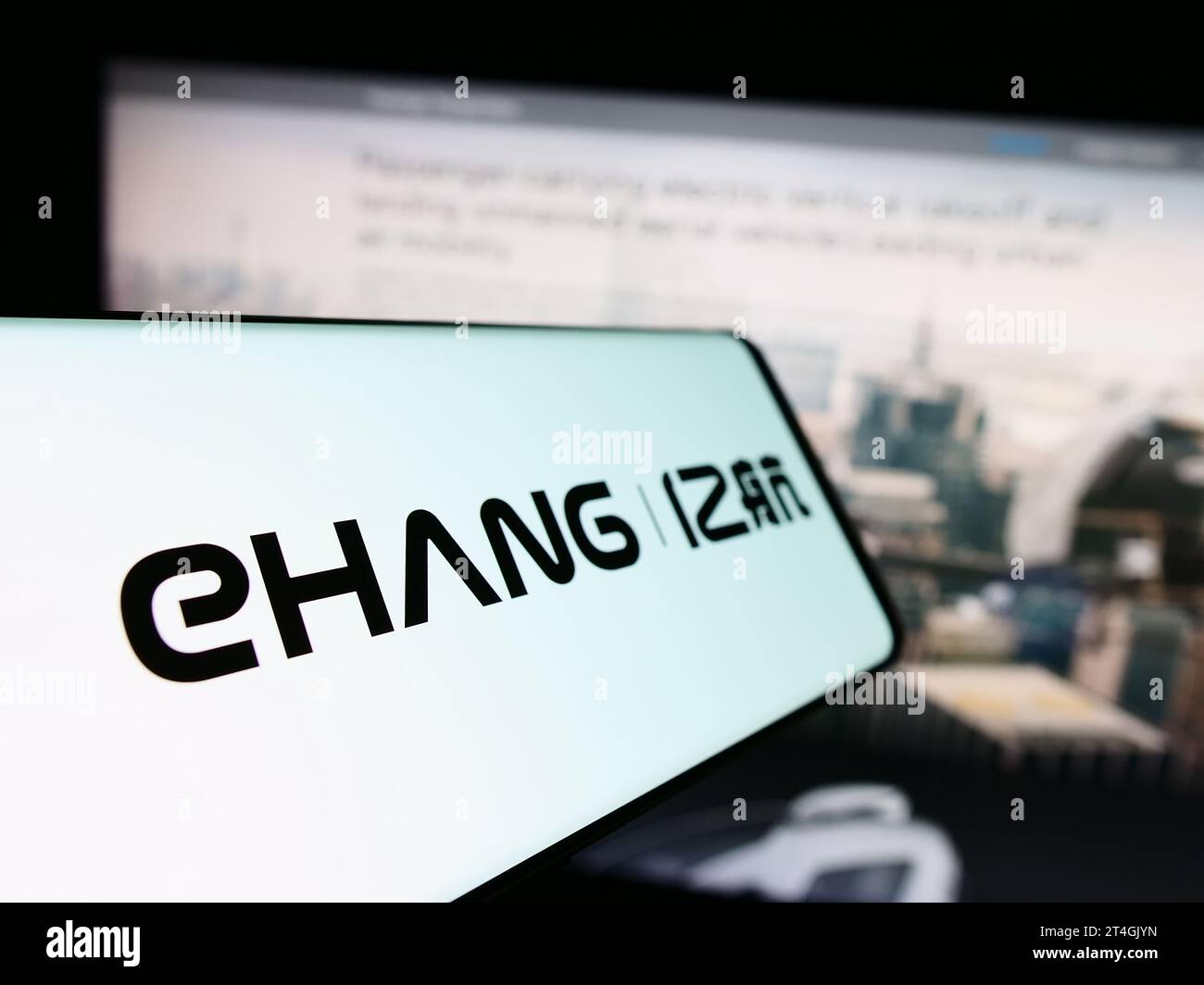Mobile phone with logo of Chinese aviation company EHang Holdings Limited in front of business website. Focus on center-left of phone display. Stock Photo