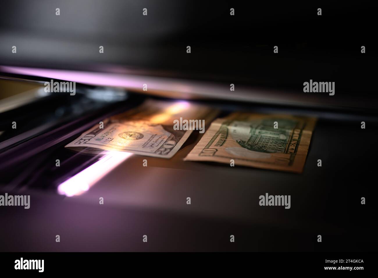 Using a copy machine to print forgery currency Stock Photo - Alamy