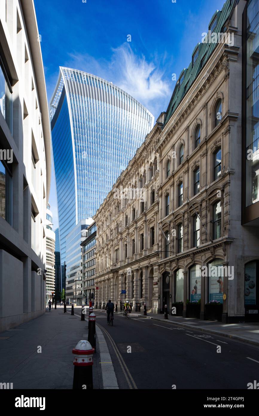 Walkie Talkie Building in contrast to traditional city buildings Stock Photo