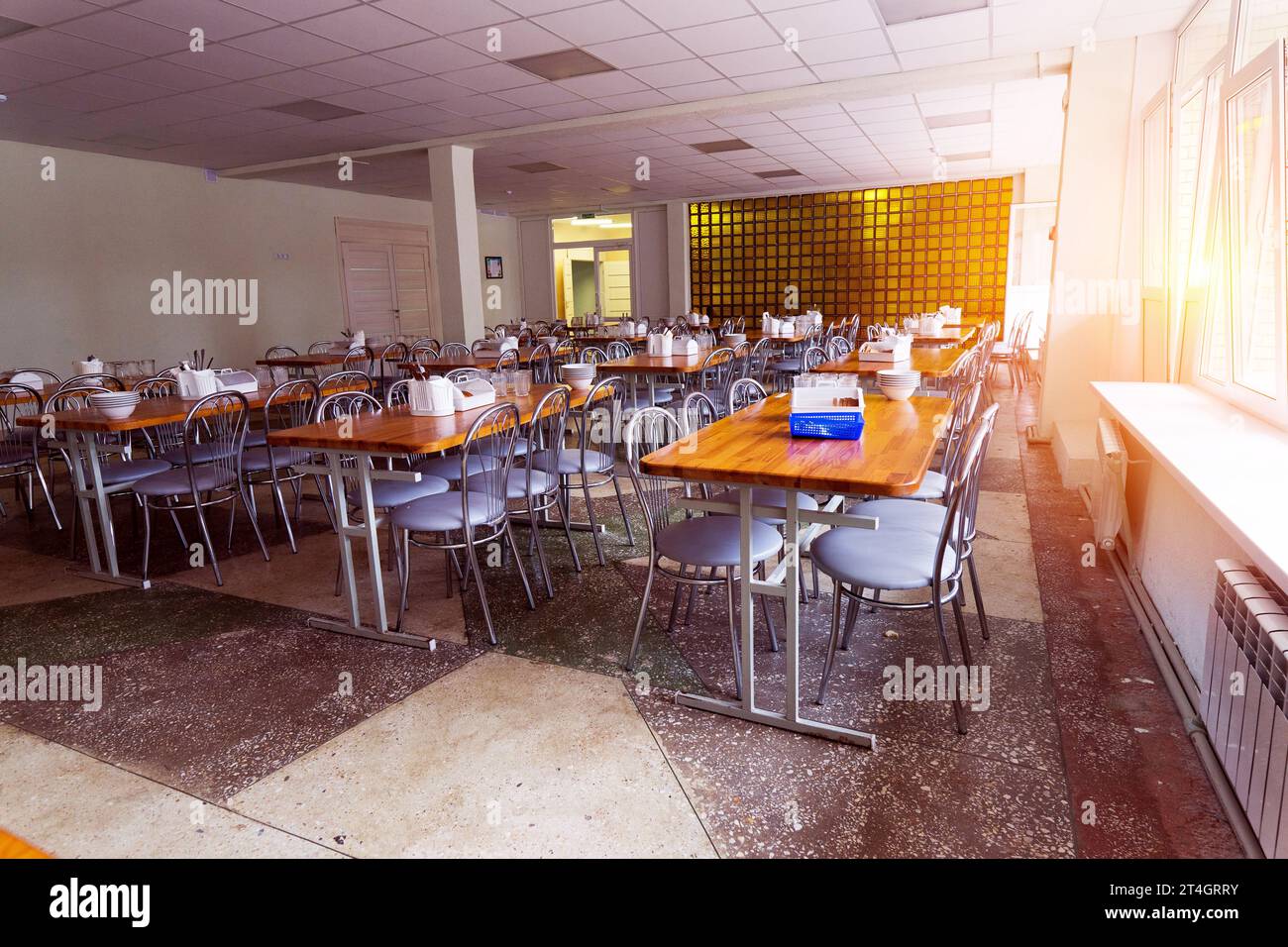Cafeteria, dining room in university, cafe with tables and chairs