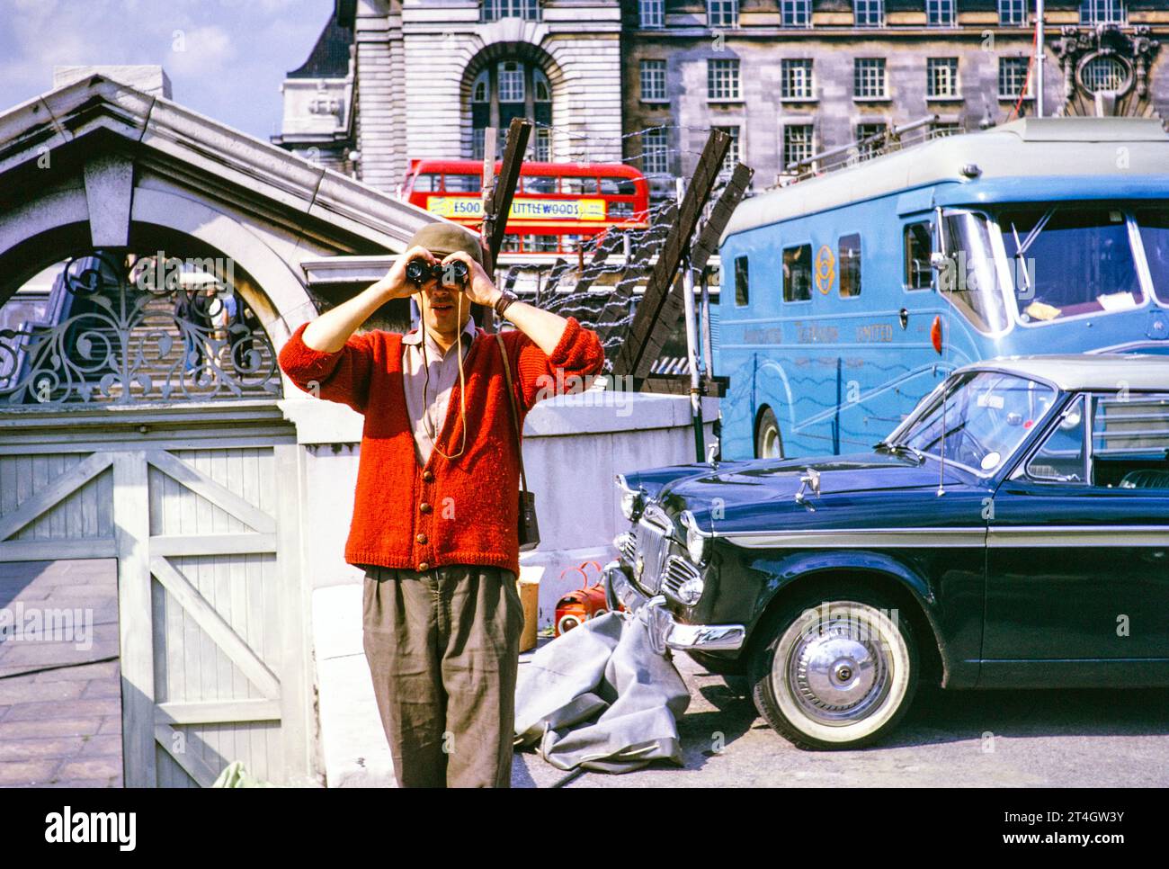 ATV outside broadcast, Telstar TV satellite launch, Westminster Bridge, London, England, UK, July 1962 - rigger Phil Comber with binoculars. Photograph by Alan 'Taffy' Harries Stock Photo