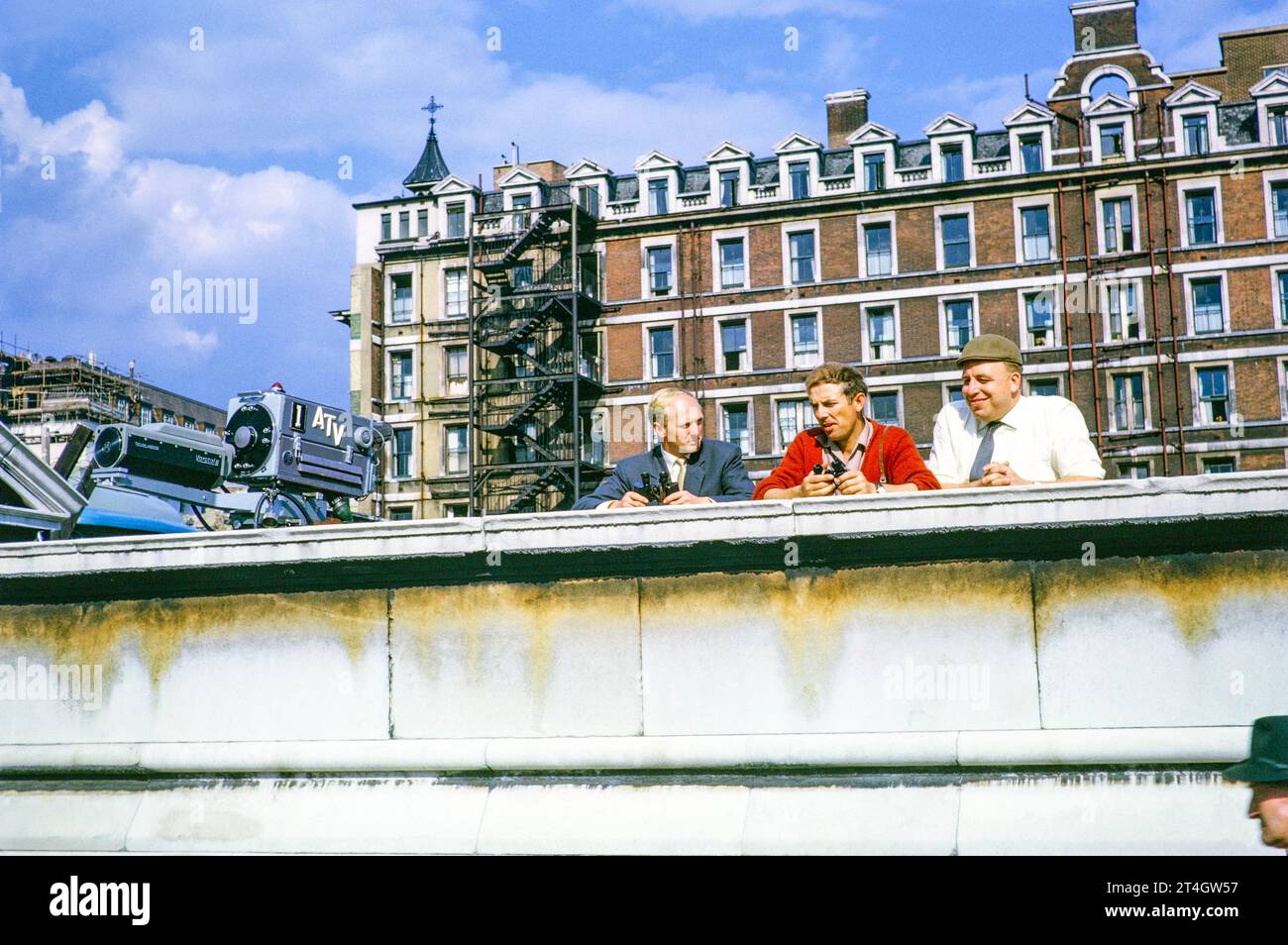 ATV outside TV broadcast, Telstar satellite launch, Westminster Bridge, London, England, UK, July 1962, Mike Whitcutt cameraman, Phil Comber rigger, 'Tiny' Crane vision engineer. Photograph by Alan 'Taffy' Harries Stock Photo