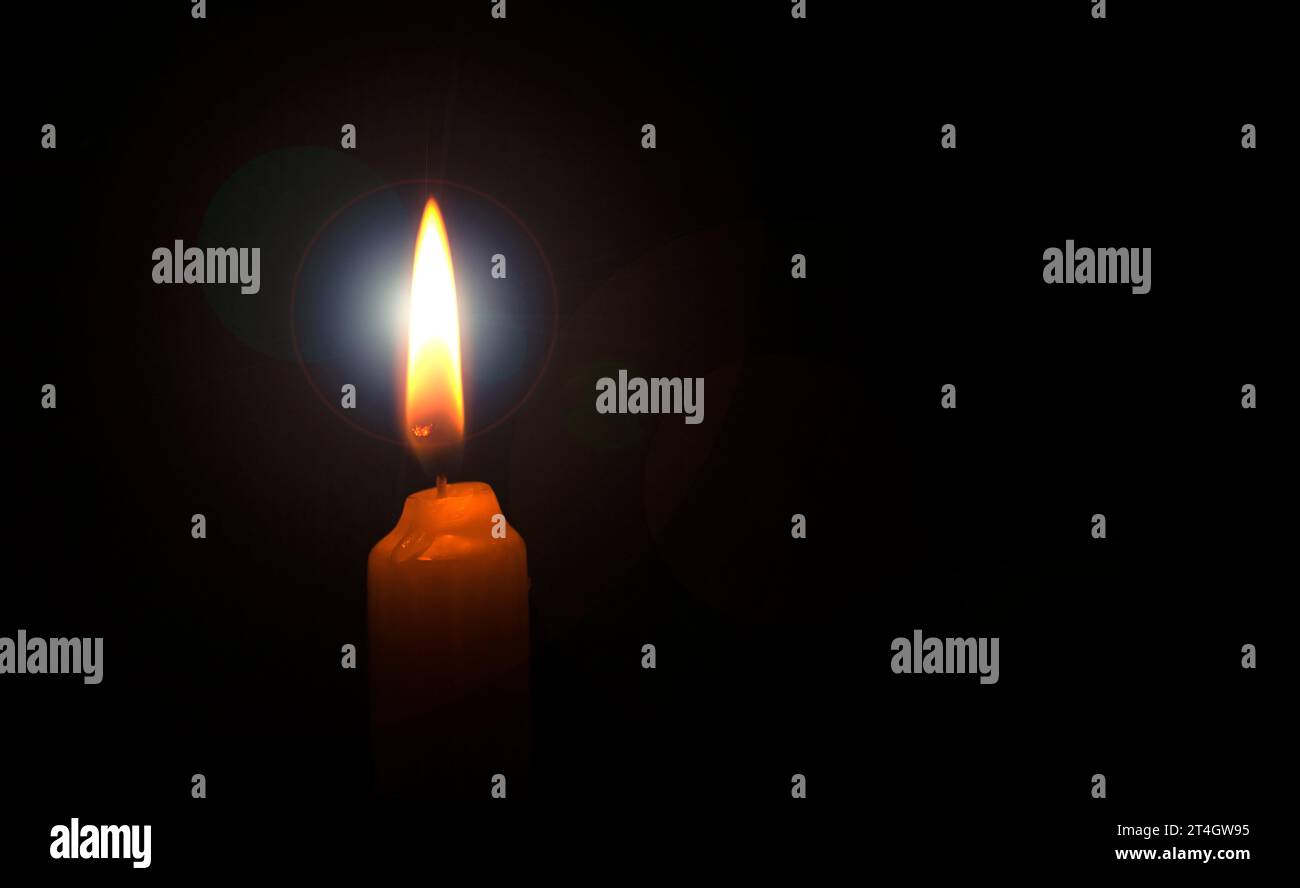 burning candle flame on the black background Stock Photo - Alamy