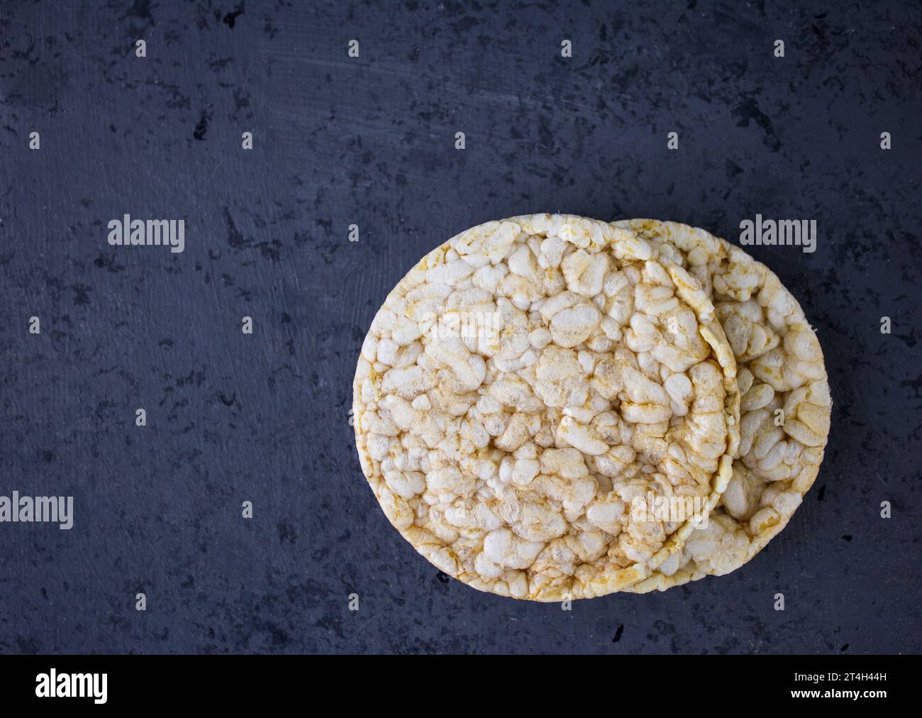 Rice cakes on grey background with text space Stock Photo