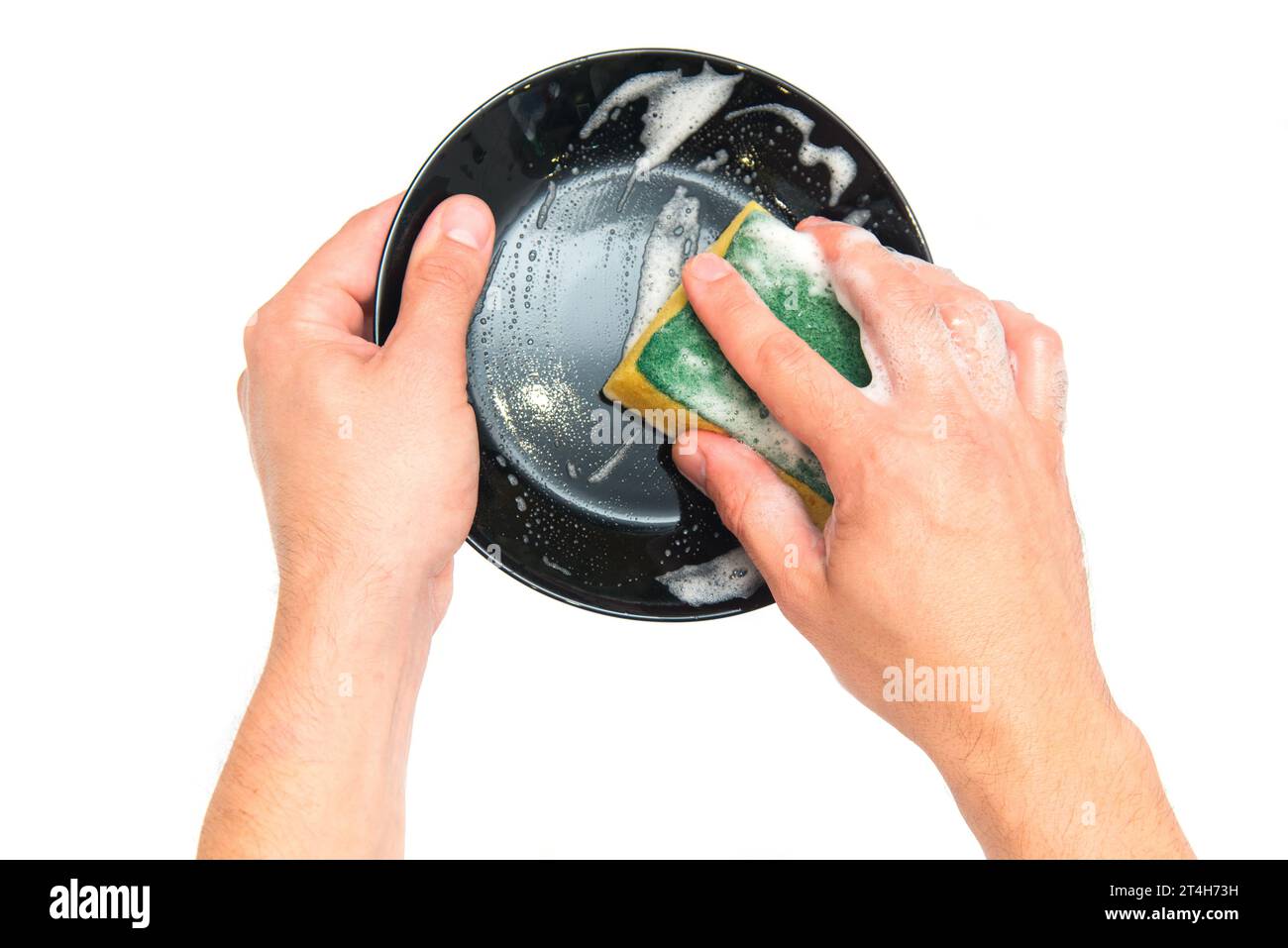 Washing the plate. Man hands wash his plate after eating. House cleaning. Dish detergent Stock