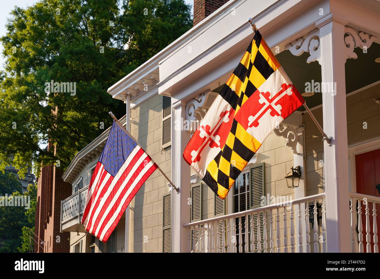 US flag and Maryland state flag on wooden porch in Annapolis, the capital city of Maryland, USA. Stock Photo
