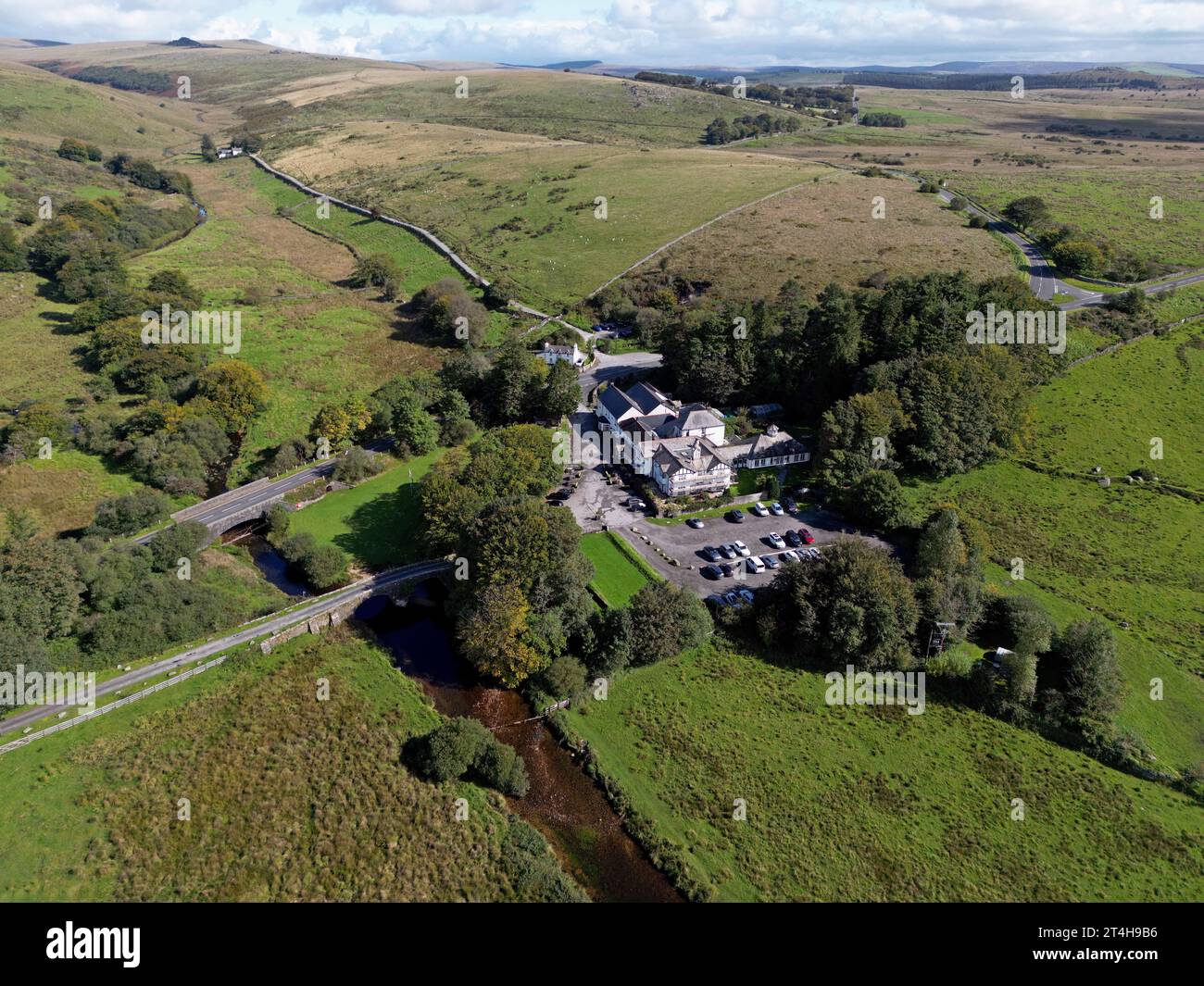 Aerial drone view of the Two Bridges hotel and bridges over the River Dart, Dartmoor National Park, Devon, Sept 2023 Stock Photo