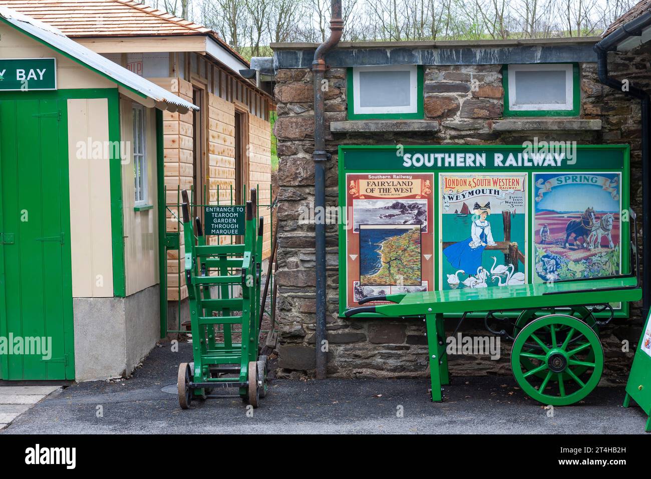 Period railway posters on the platform at Woody Bay station, Lynton and Barnstaple Railway, Devon, UK Stock Photo