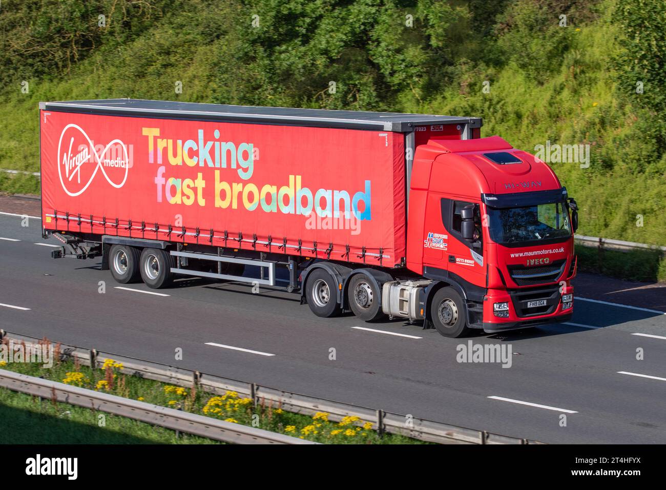 Virgin Media Trucking Fast Broadband Maun Motors Self-Drive Commercial Iveco Stralis As440s46tx/P S-A Red Diesel 11120 cc Trucks. Stock Photo