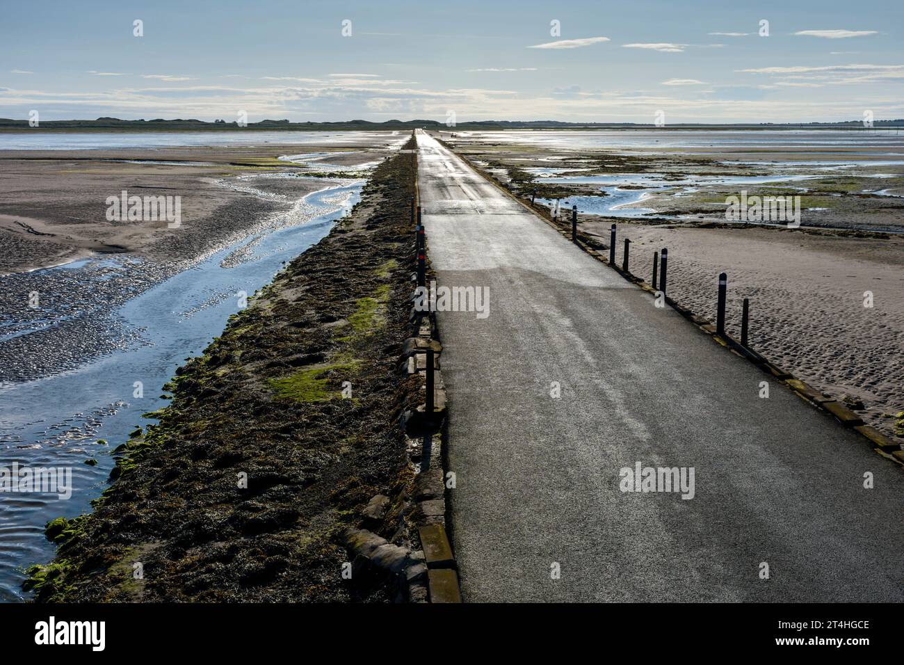 The Lindisfarne Causeway to Holy Island  The causeway is submerged twice a day by the tides.  Northumberland, England, UK Stock Photo