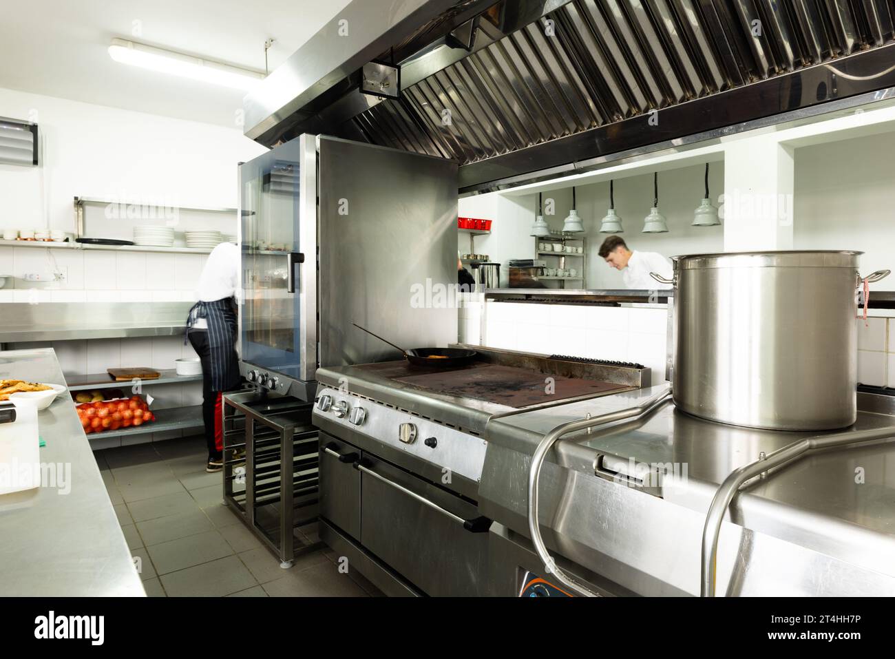 Interior of commercial kitchen with various modern appliances and utensils Stock Photo