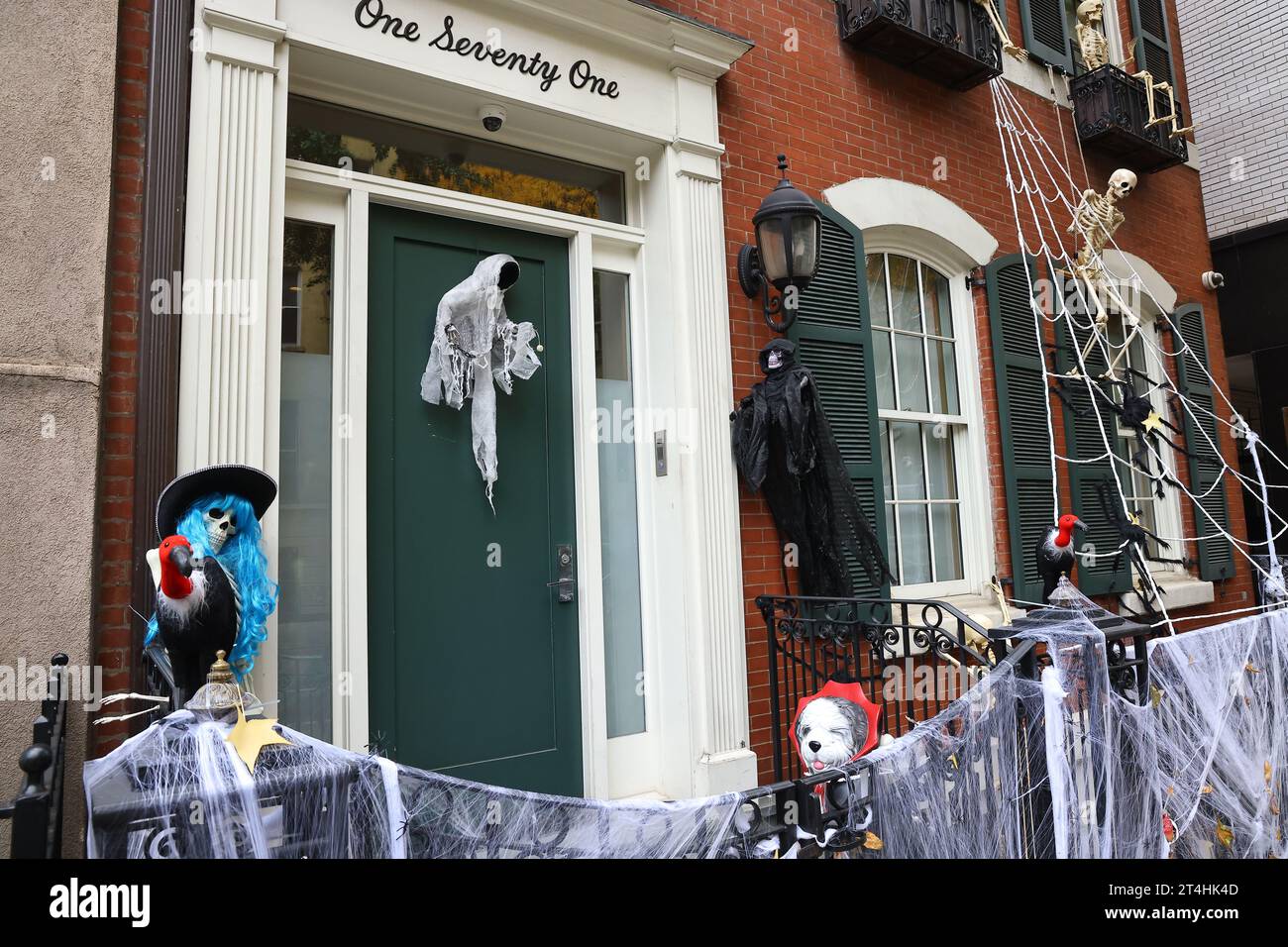 Frightening Halloween decorations cover the outside of an Upper East