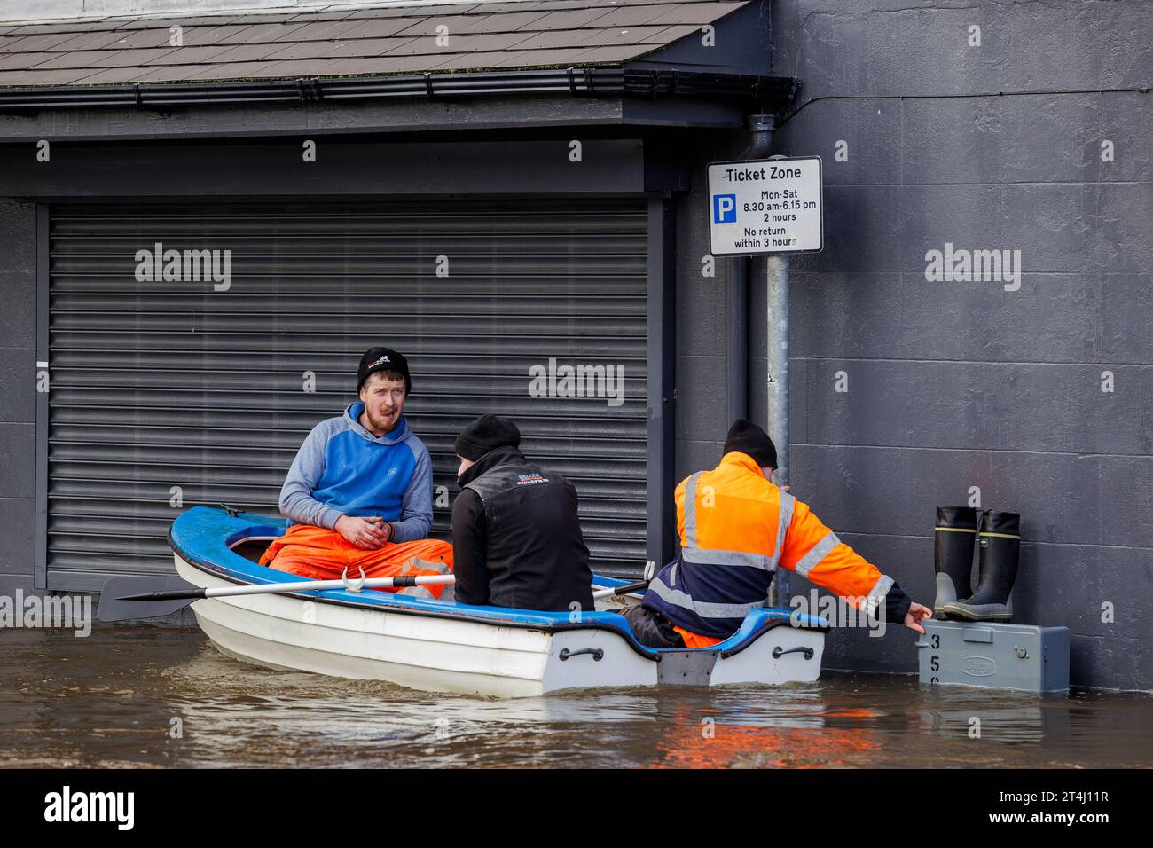 People canoe down a flooded Bank Parade in Newry Town, Co Down
