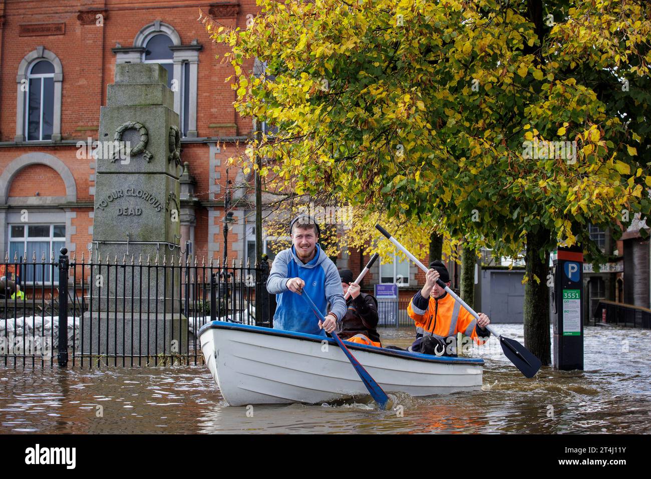 People canoe down a flooded Bank Parade in Newry Town, Co Down
