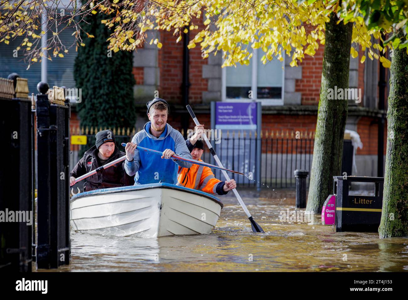 People canoe down a flooded Bank Parade in Newry Town, Co Down